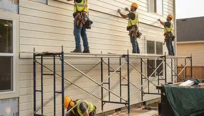 Professional vinyl siding installation on a home in Virginia Beach, VA for coastal weather protection